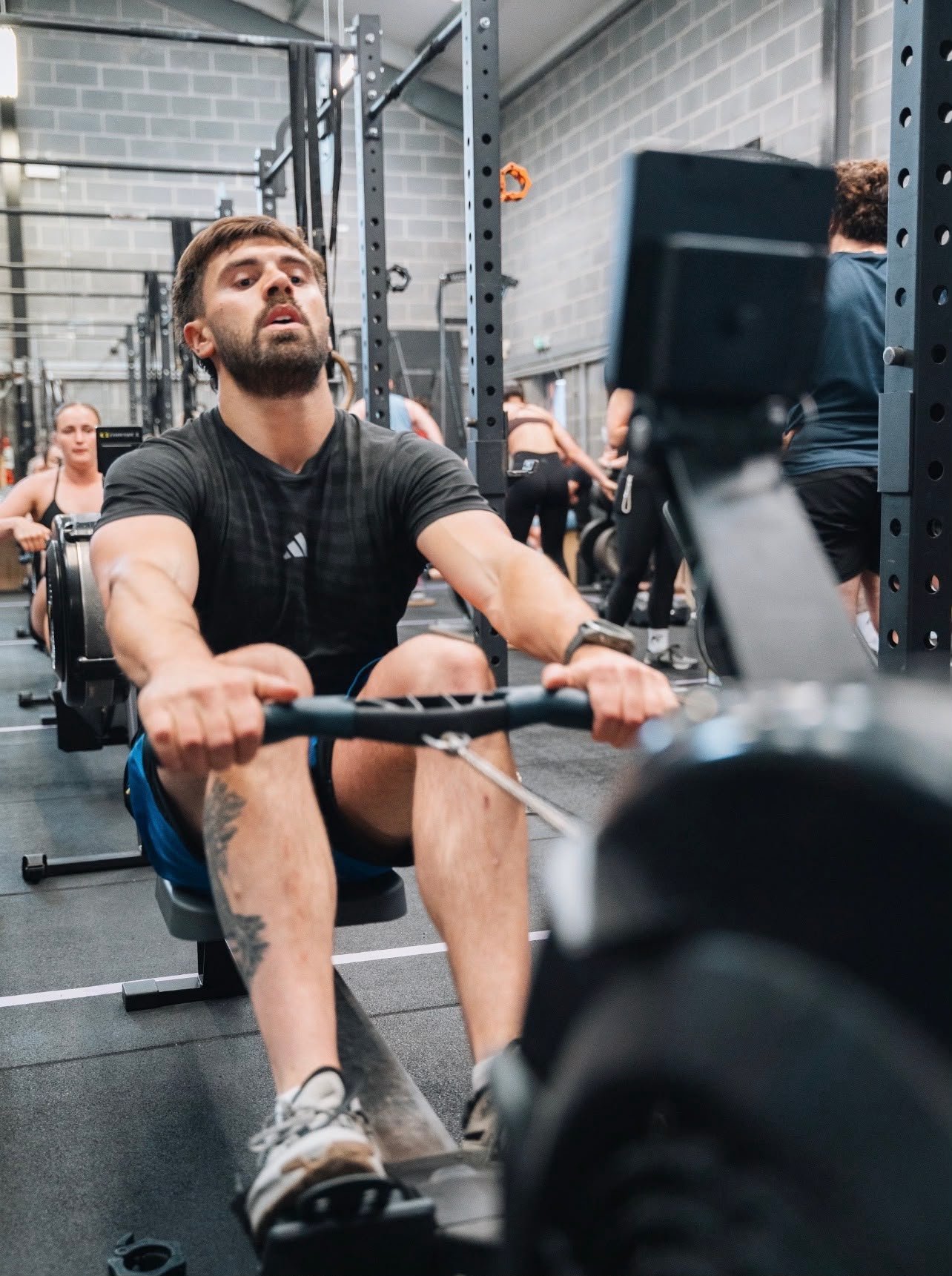 AlphaFit athlete training on a rowing machine